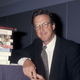 Michael Crichton in 2000, busily inventing an unwritten novel about a camera that kills. (Photo: Getty Images)